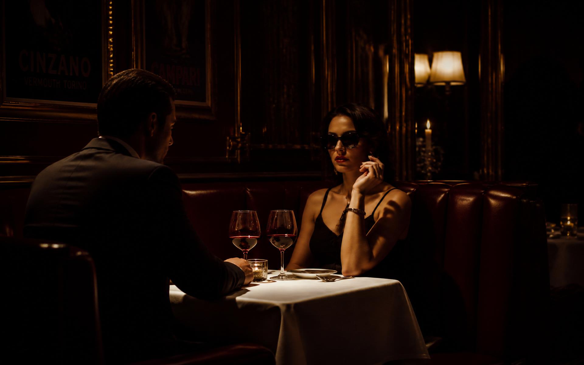 A discreet meeting in a dim Italian restaurant